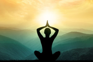 Yoga and meditation. Silhouette of man in moontains. Yoga and meditation. Silhouette of man in moontains.